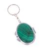 Складное зеркало брелок из малахита овальное фото 1 — 